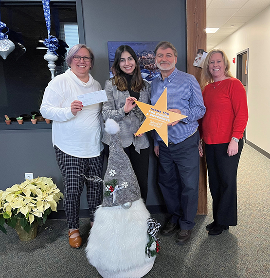 Making A Difference group photo presenting donation to NSCAP