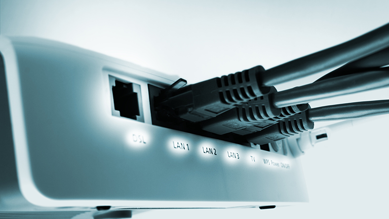 Close up of home wifi router switch with black cables