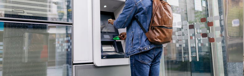 Person standing in front of ATM machine
