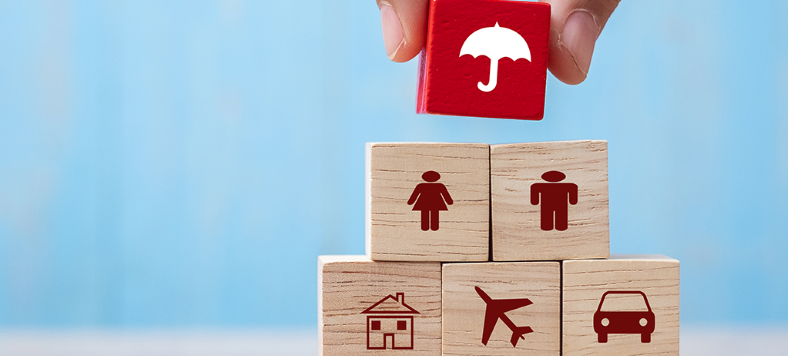 Red umbrella image on wooden stacked blocks
