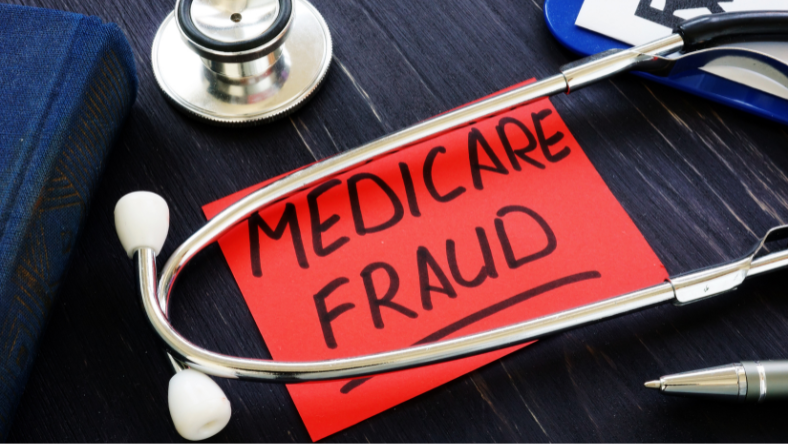 Stethoscope on table with note written - Medicare Fraud