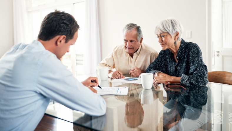 Mature couple reviewing retirement documents