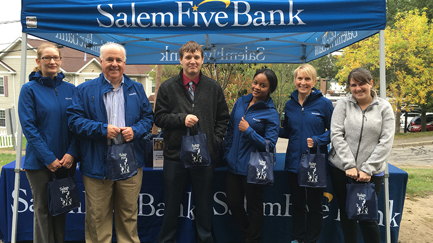Six Salem Five employees standing under Salem Five event tent