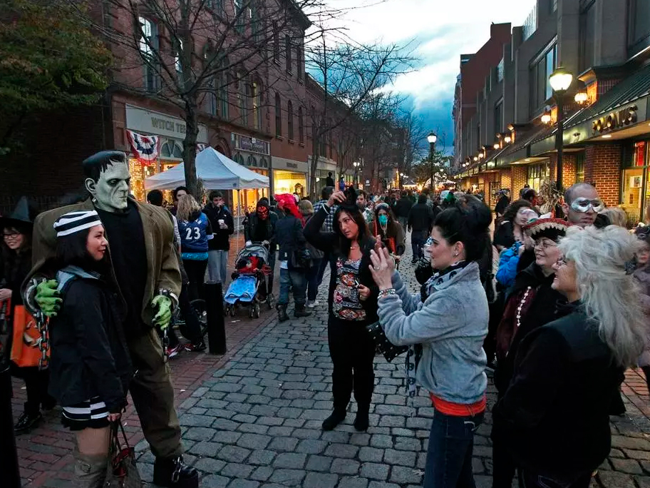 Tourists posing for Halloween photos in downtown Salem, MA