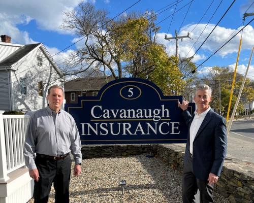 Salem Five Representatives standing next to Cavanaugh Insurance Sign