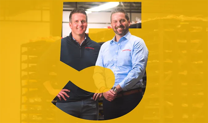 Two men standing in Bakery setting with a large stylized number 5 overlay.